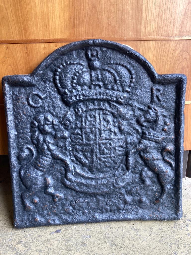 A heavy cast iron fireback, width 54cm, height 58cm